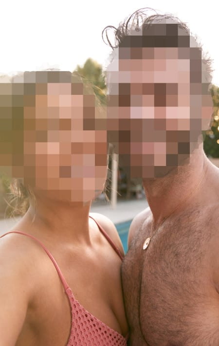A HOT 40-ISH WOMAN IN A BIKINI STANDING NEXT TO A STUDLY GUY WITH SIX PACK ABS